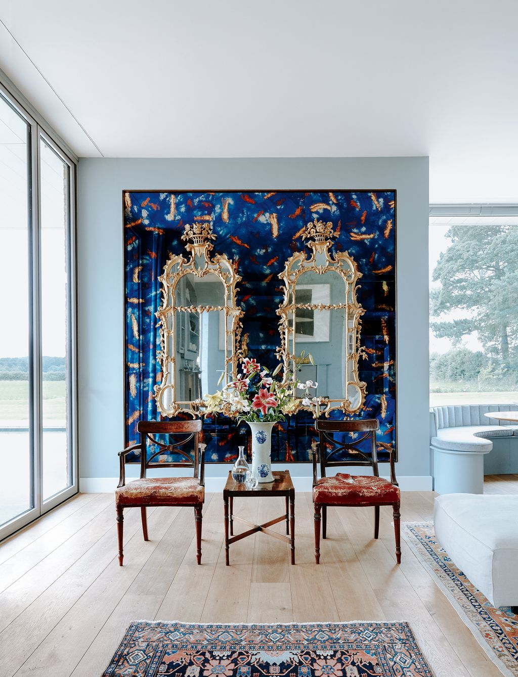 Image may contain Interior Design Indoors Flooring Floor Living Room Room Furniture Chair and Rug