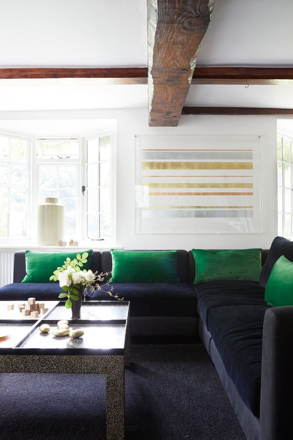 The sitting area has a threemetrelong sofa designed by Sarah and made by Origins Designs.