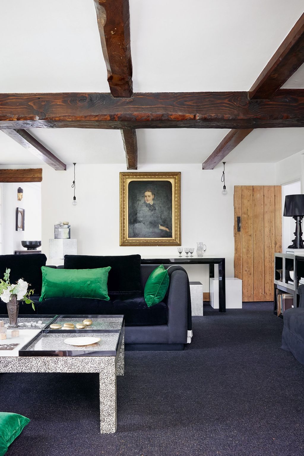 Image may contain Furniture Couch Living Room Room Indoors Table Housing Building Coffee Table Human and Person