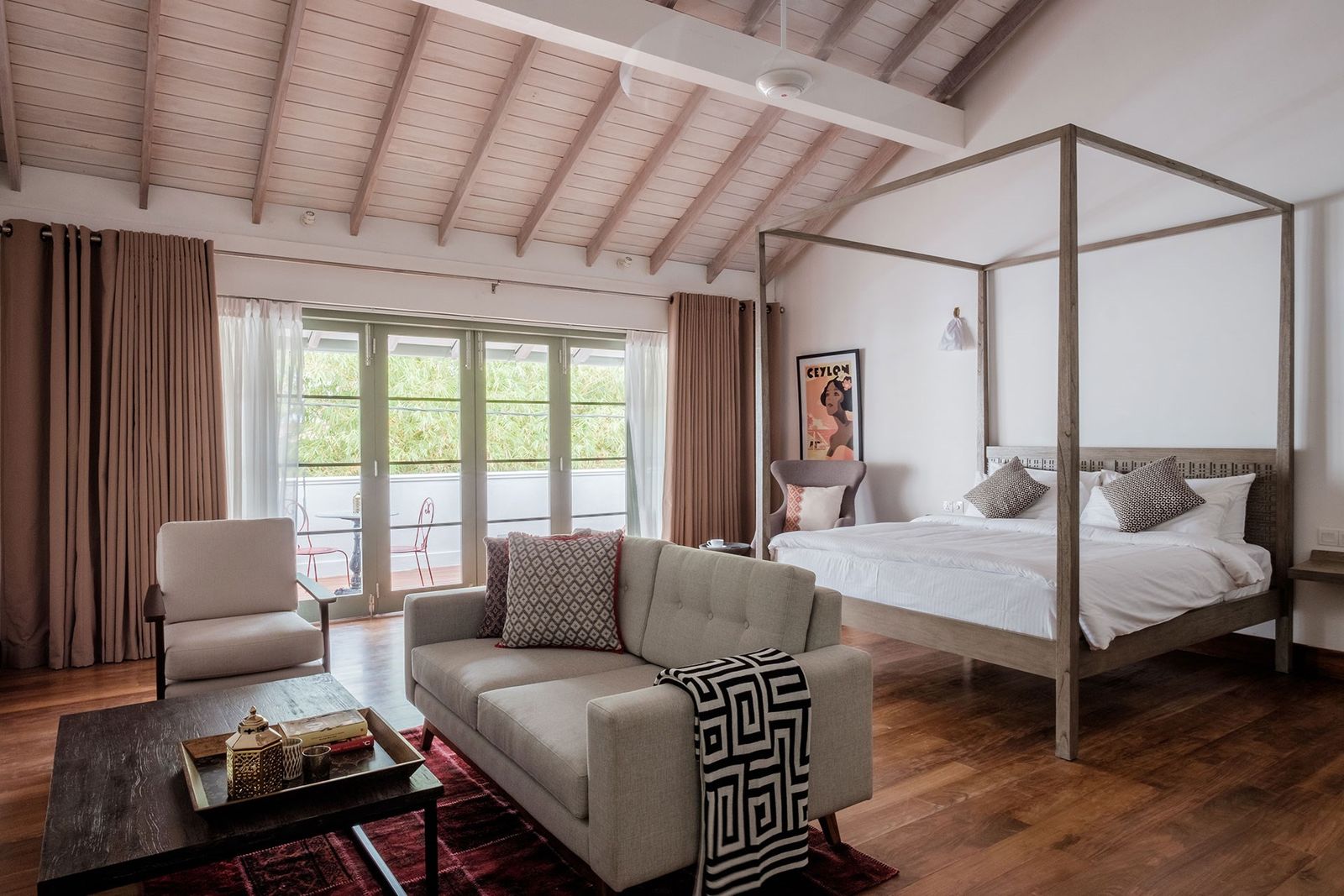 Image may contain Furniture Living Room Room Indoors Wood Flooring Interior Design Table Couch and Hardwood