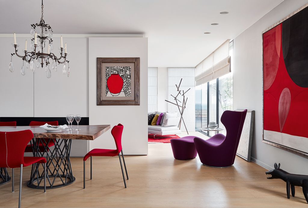 Image may contain Furniture Chair Flooring Living Room Room Indoors Dining Room Table Wood Lamp and Chandelier