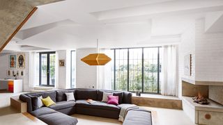 Image may contain Furniture Living Room Room Indoors Interior Design Couch Housing Building Table and Flooring