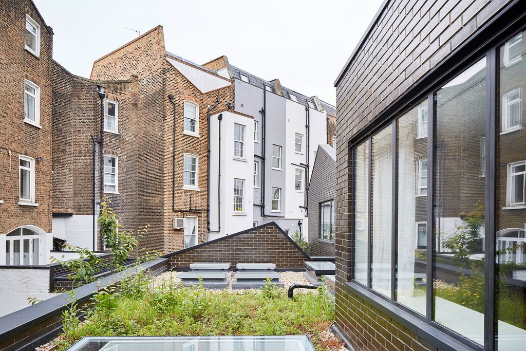 Image may contain City Town High Rise Building Urban Home Decor and Apartment Building