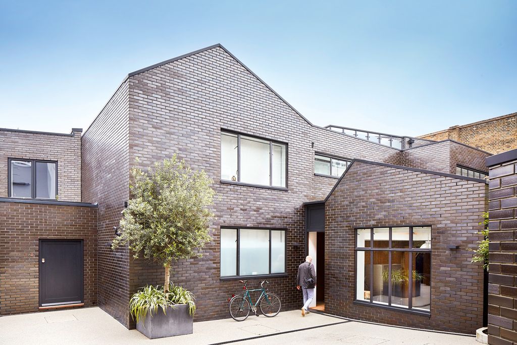 Image may contain Human Person Vehicle Transportation Bicycle Bike Wheel Machine Building and Housing