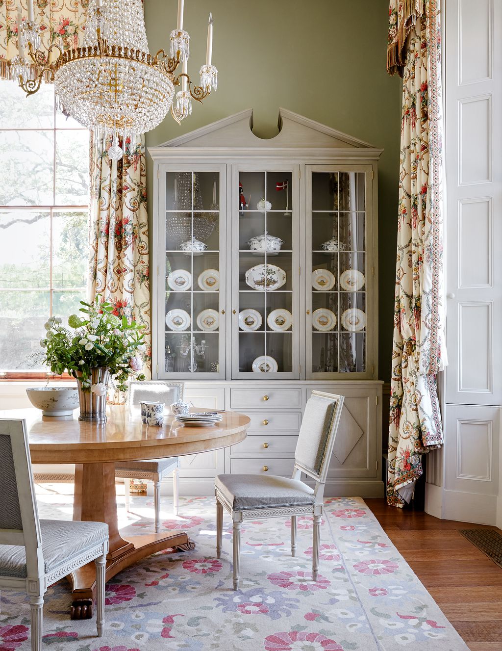 Image may contain Furniture Room Indoors Dining Room Chair Interior Design Cabinet China Cabinet Table and Rug