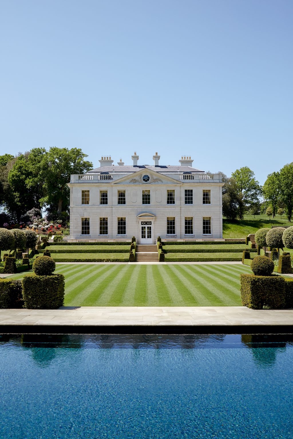 Image may contain Plant Grass Human Person Lawn Hedge Fence and Campus