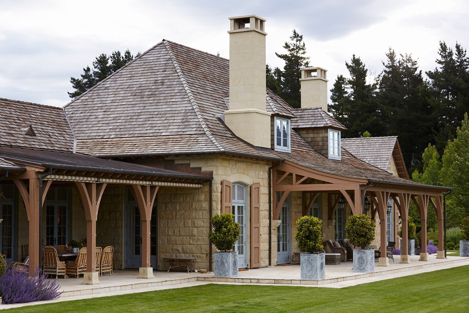 Image may contain Patio Porch Grass Plant Pergola Roof Housing and Building