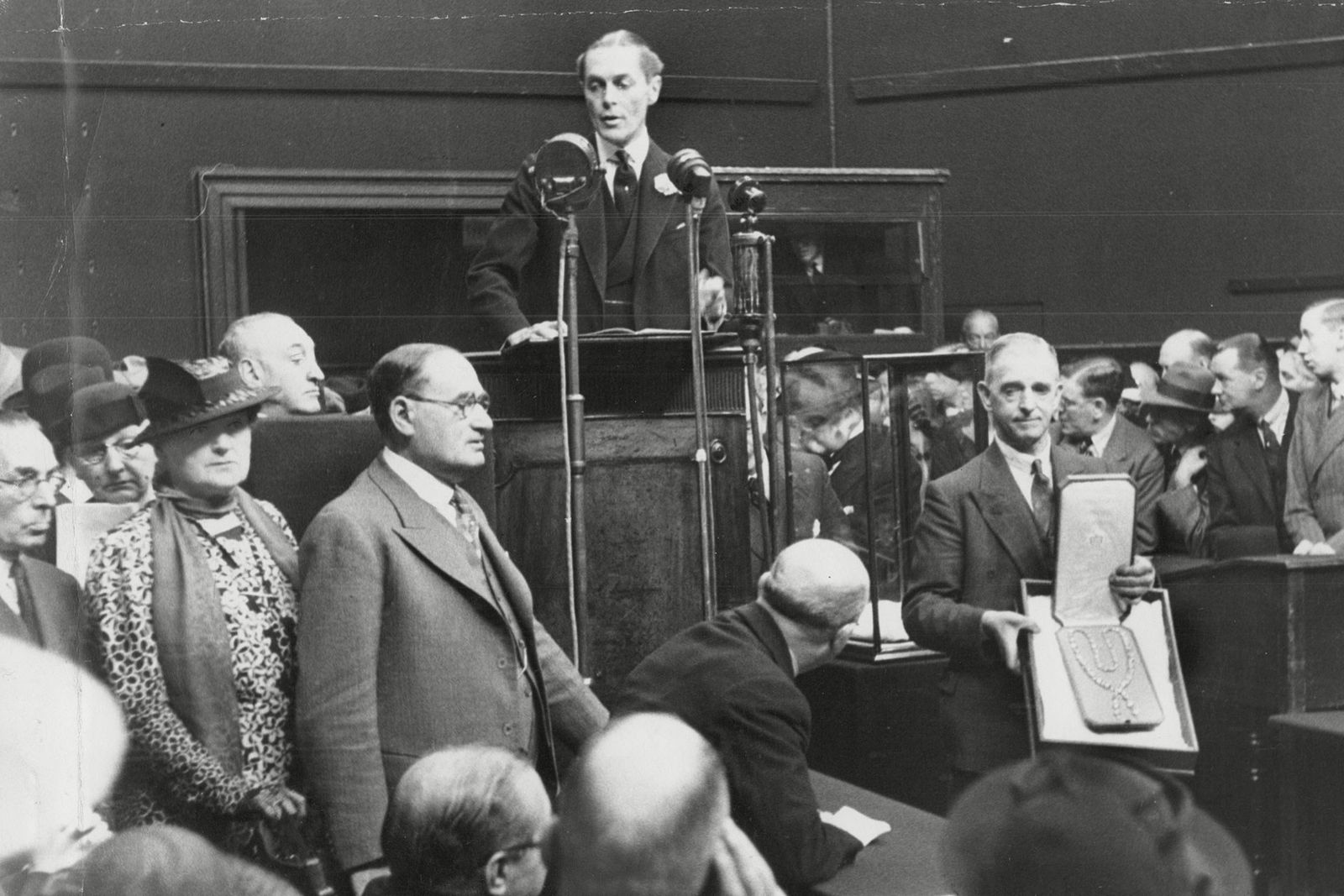 Image may contain Human Person Crowd Tie Accessories Accessory Audience and Jury