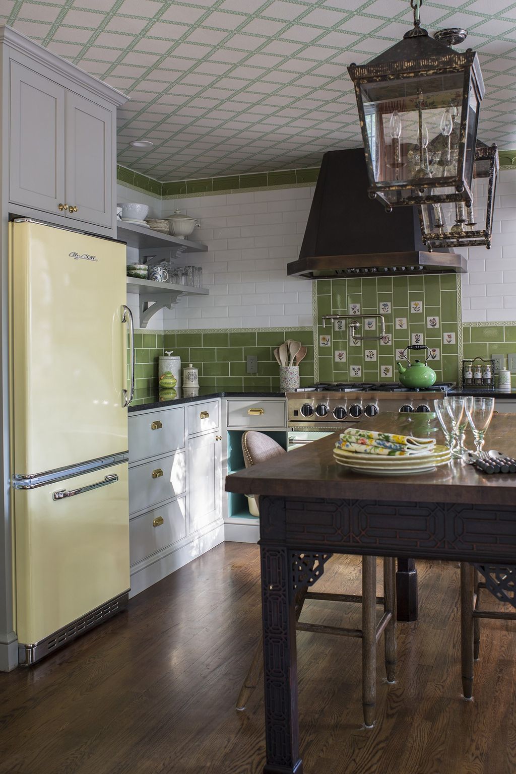 Image may contain Appliance Refrigerator Indoors Room Kitchen Wood and Kitchen Island