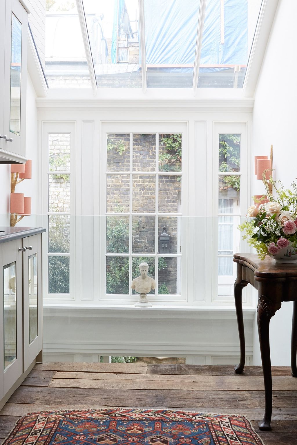 Image may contain Plant Human Person Rug Flower Blossom Picture Window Interior Design and Indoors