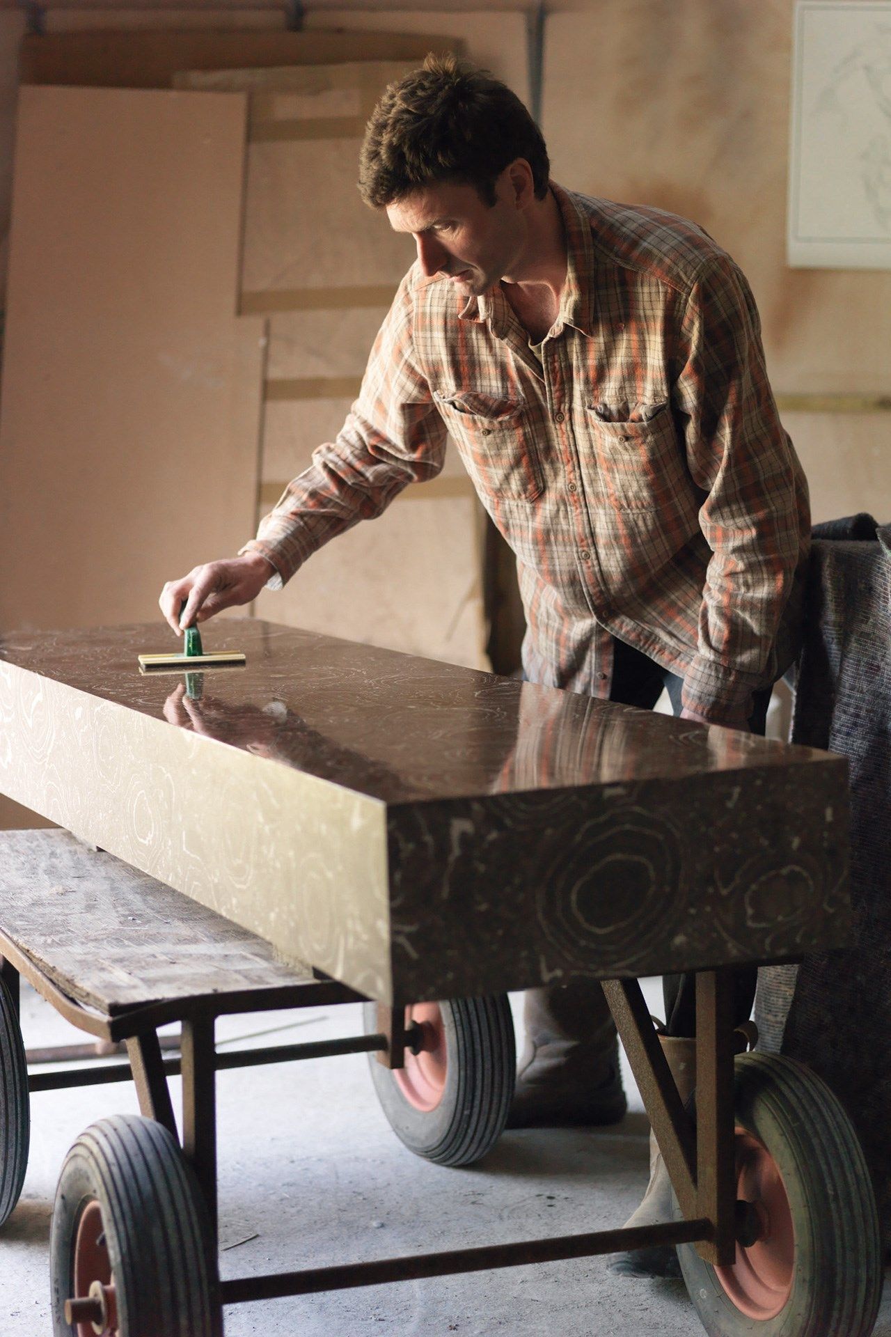 Image may contain Wood Plywood Wheel Machine Human Person and Leisure Activities