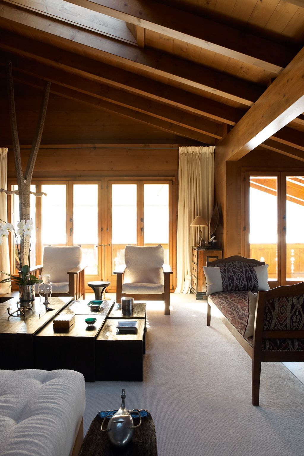 Image may contain Furniture Living Room Room Indoors Chair Wood Couch Interior Design Housing and Building