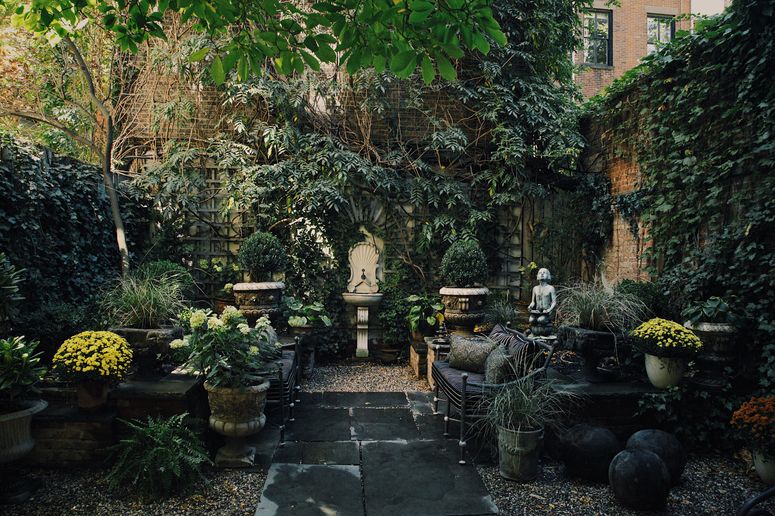 Image may contain: Flagstone, Human, Person, Patio, Outdoors, Garden, and Arbour