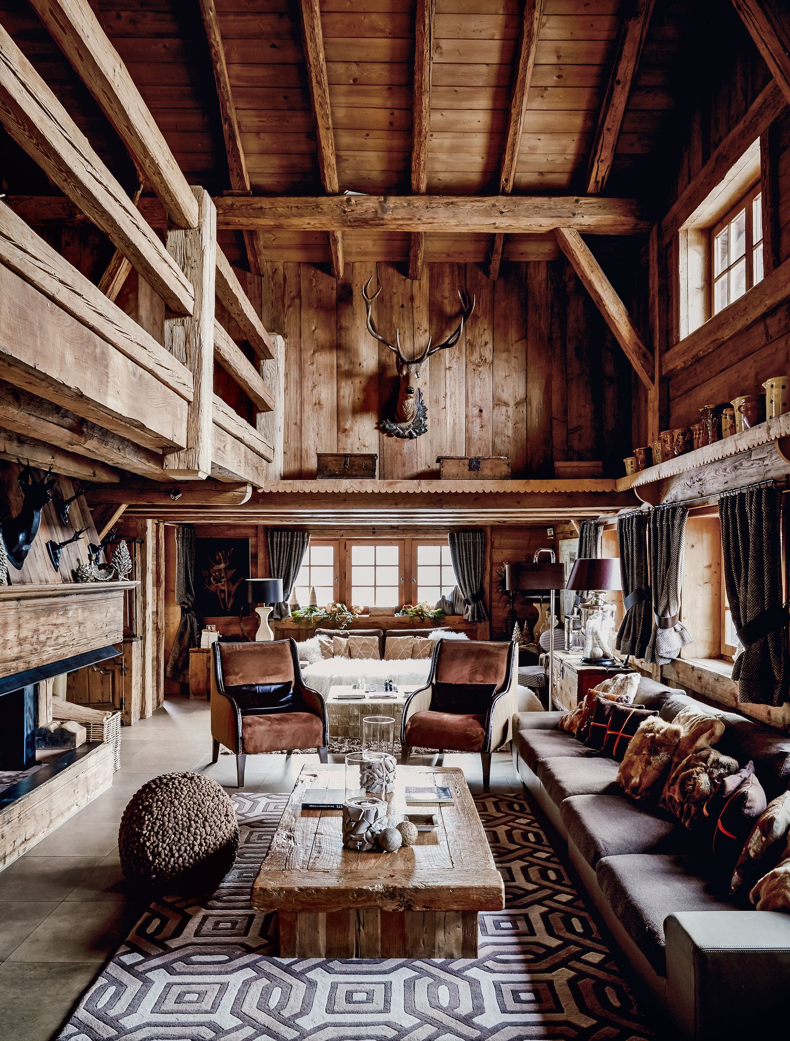 Image may contain Housing Building Indoors Wood Living Room Room Furniture Loft Rug Chair and Couch