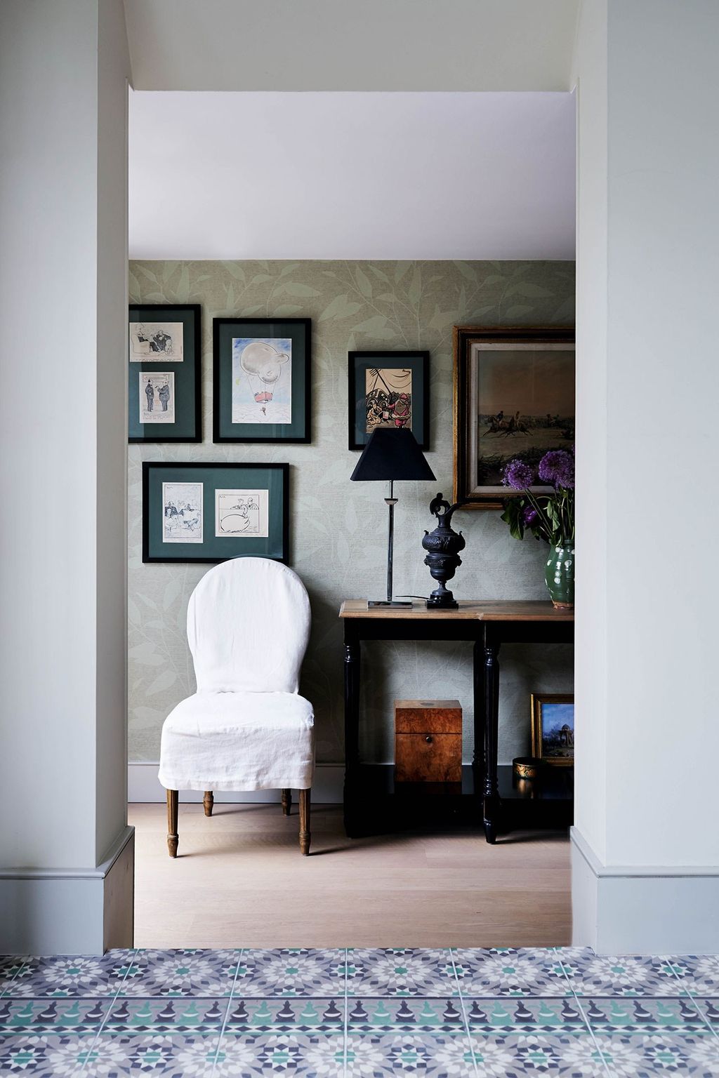 Image may contain Furniture Interior Design Indoors Living Room Room Rug Lamp Table Lamp and Flooring