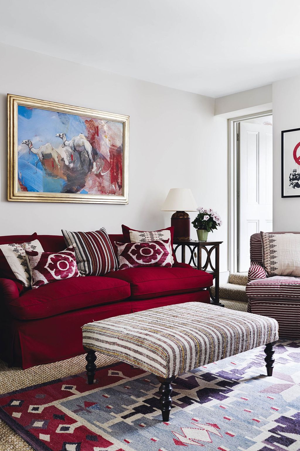 Image may contain Furniture Rug Couch Living Room Indoors and Room