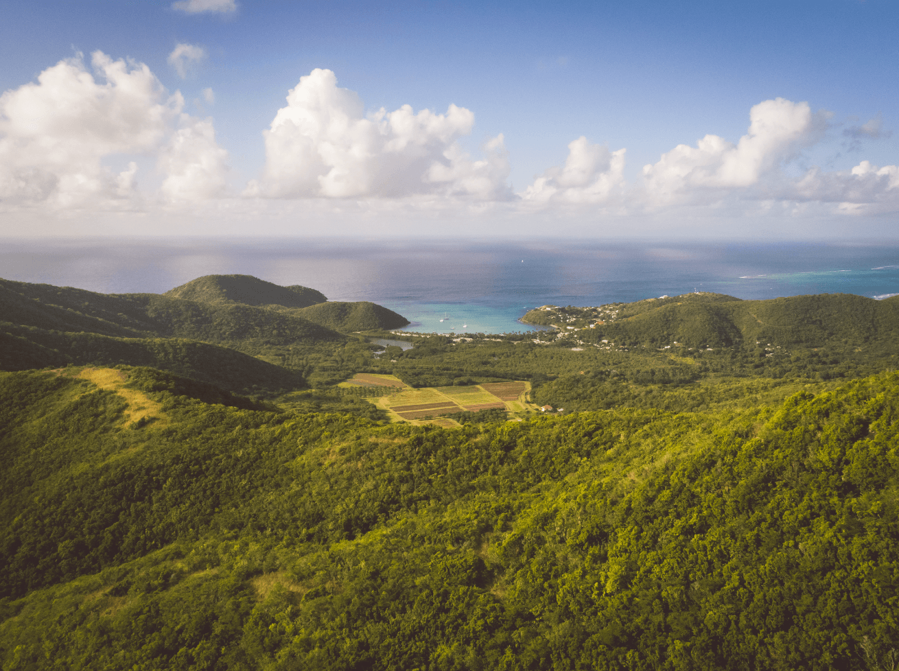 Image may contain Nature Outdoors Hill Countryside Weather Sky Cumulus and Cloud