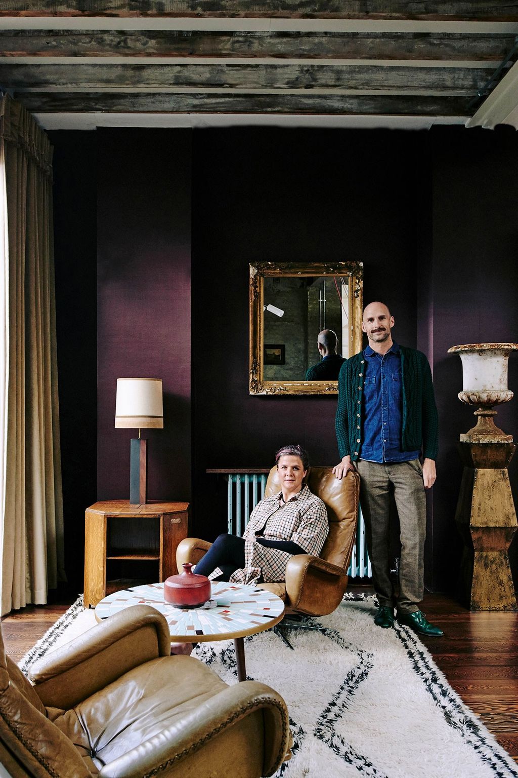 Image may contain Human Person Living Room Indoors Room Furniture Couch Interior Design Wood and Home Decor