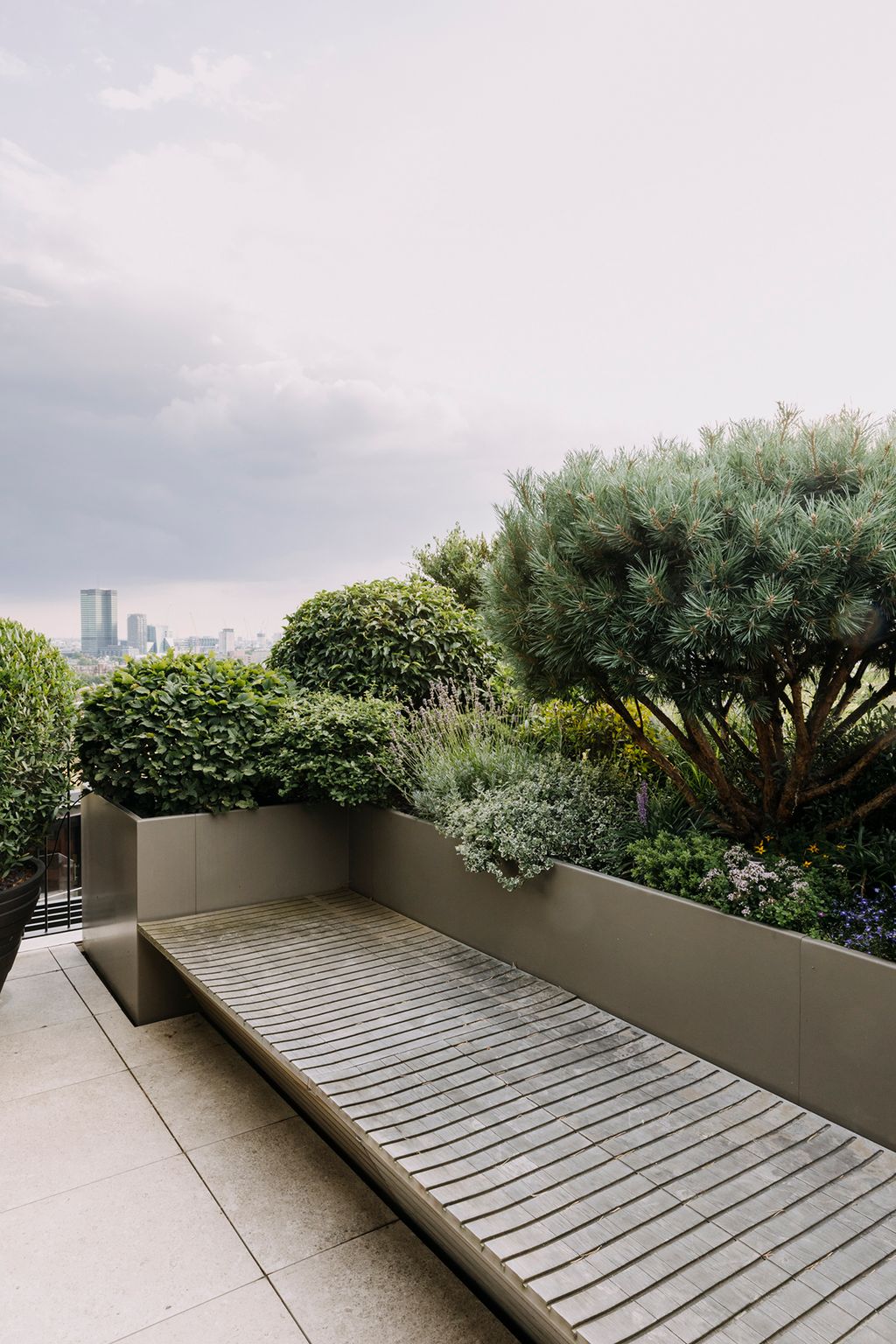Benches have been built around the planters to provide streamlined seating.