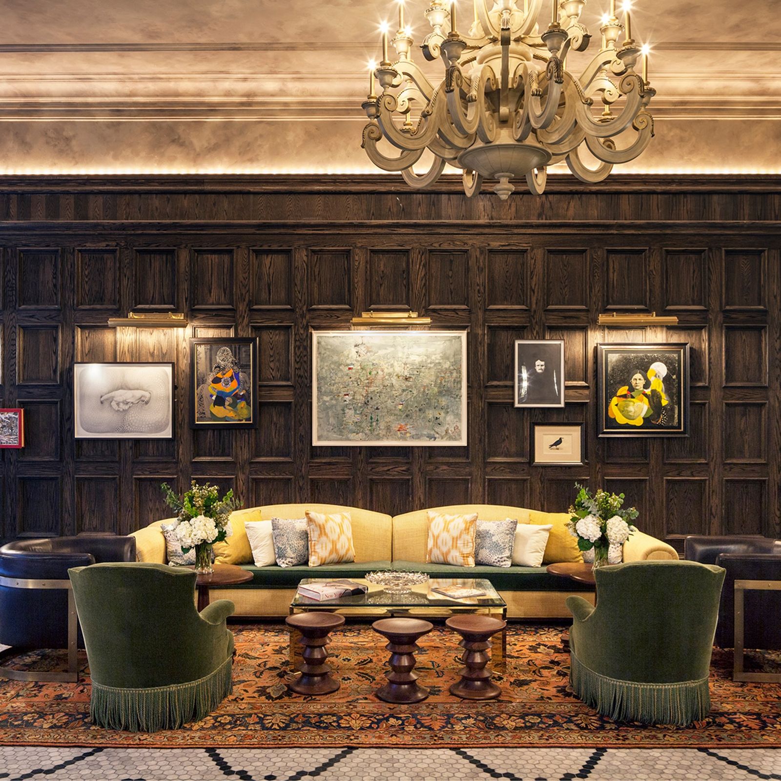 Image may contain Furniture Room Indoors Living Room Lobby Couch Waiting Room Lamp Chandelier and Rug