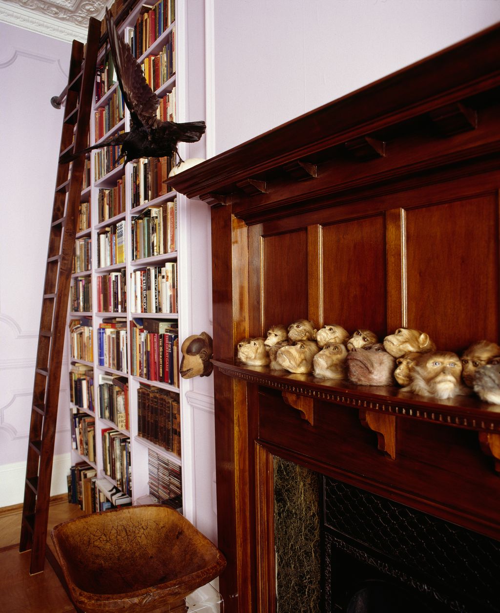 Image may contain Furniture Bookcase Wood Shelf Hardwood Interior Design and Indoors