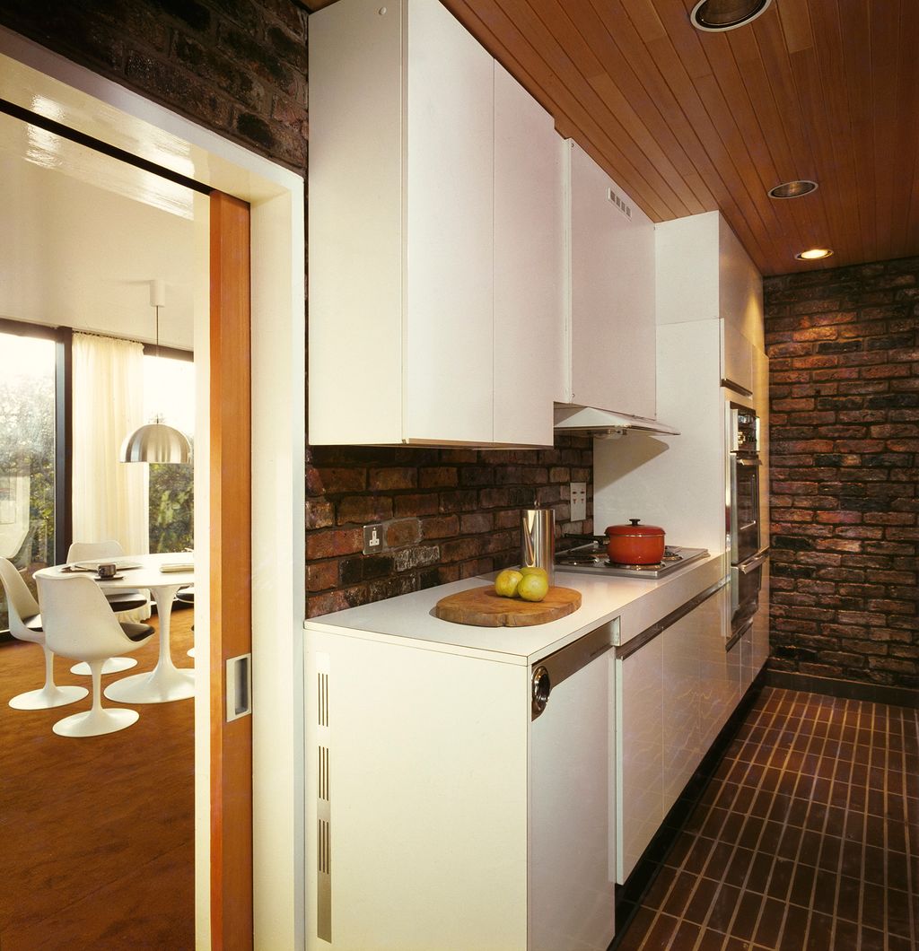 Image may contain Flooring Room Indoors Kitchen Floor Wood Kitchen Island and Interior Design