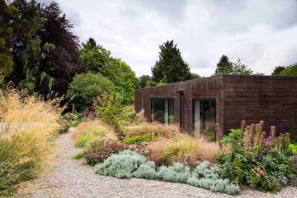 Image may contain Outdoors Plant Nature Building House Cottage Housing Vegetation Shelter Countryside and Rural