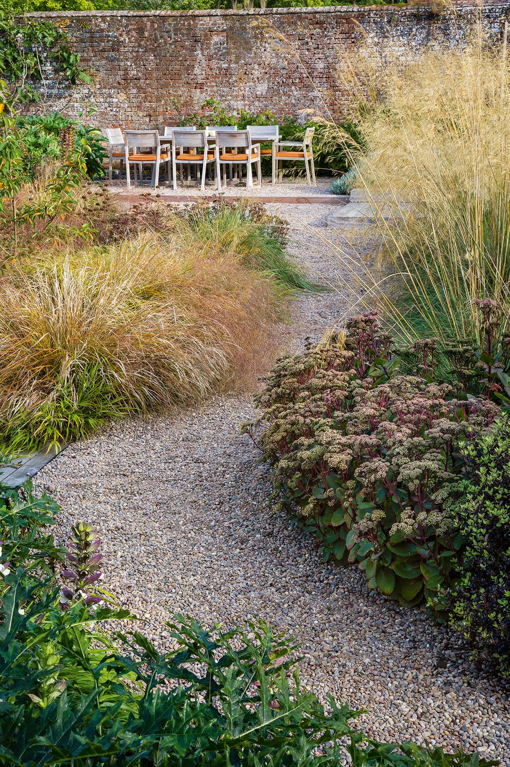 A gravel path leads to the dining platform.