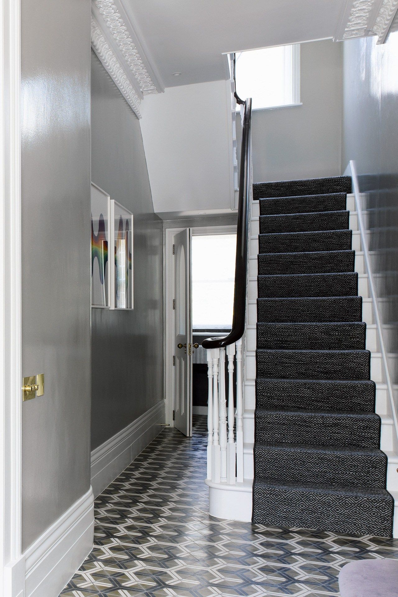 Image may contain Interior Design Indoors Staircase Banister Handrail Flooring Floor and Door