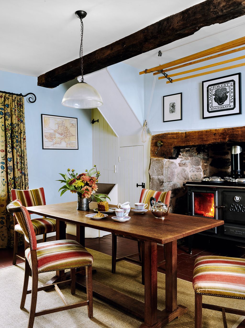 Image may contain Furniture Chair Room Indoors Interior Design Wood Table Dining Table Living Room and Dining Room