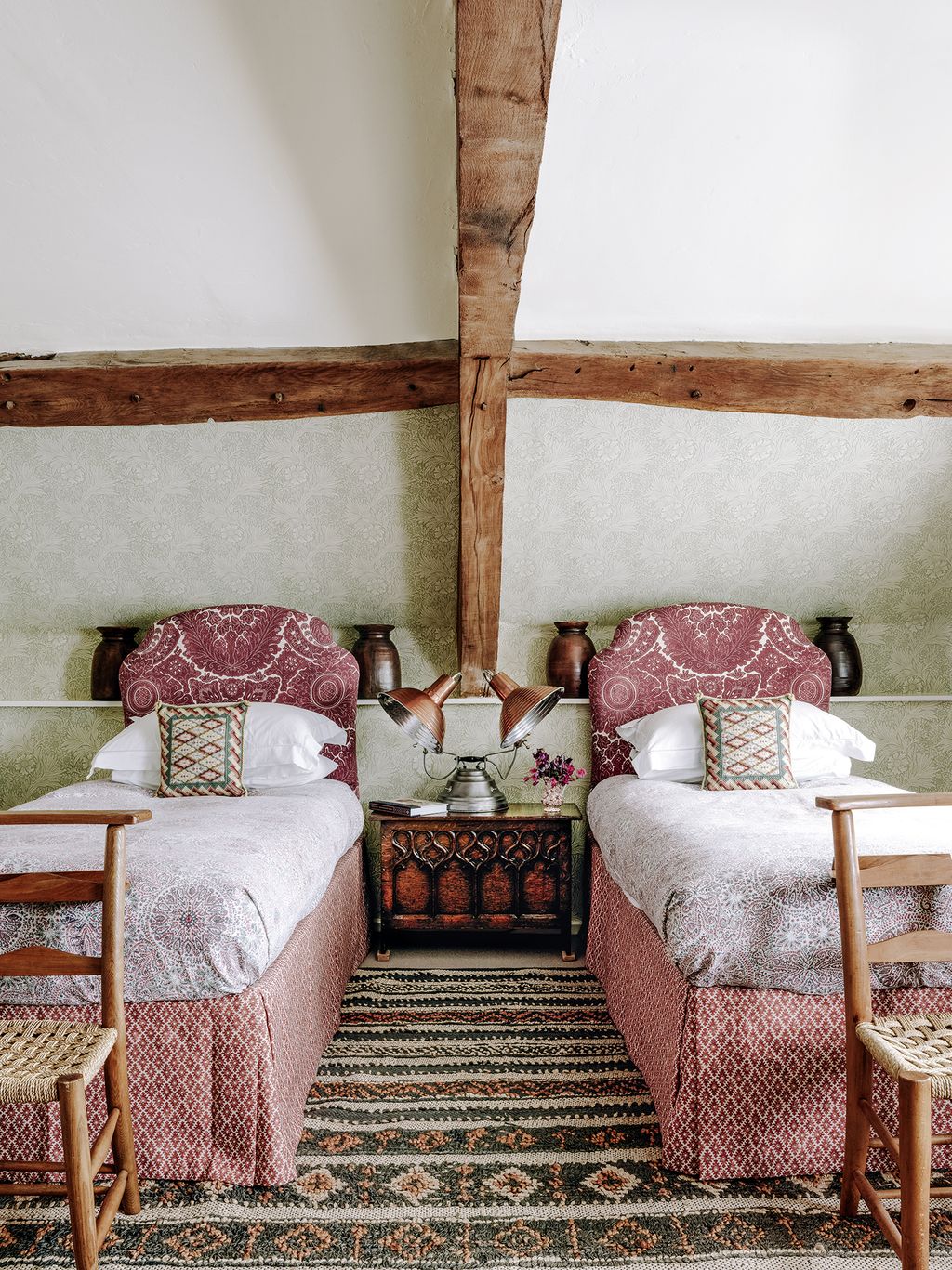 Image may contain Living Room Room Indoors Furniture Couch Wood Rug Hardwood Bedroom Interior Design and Shelf