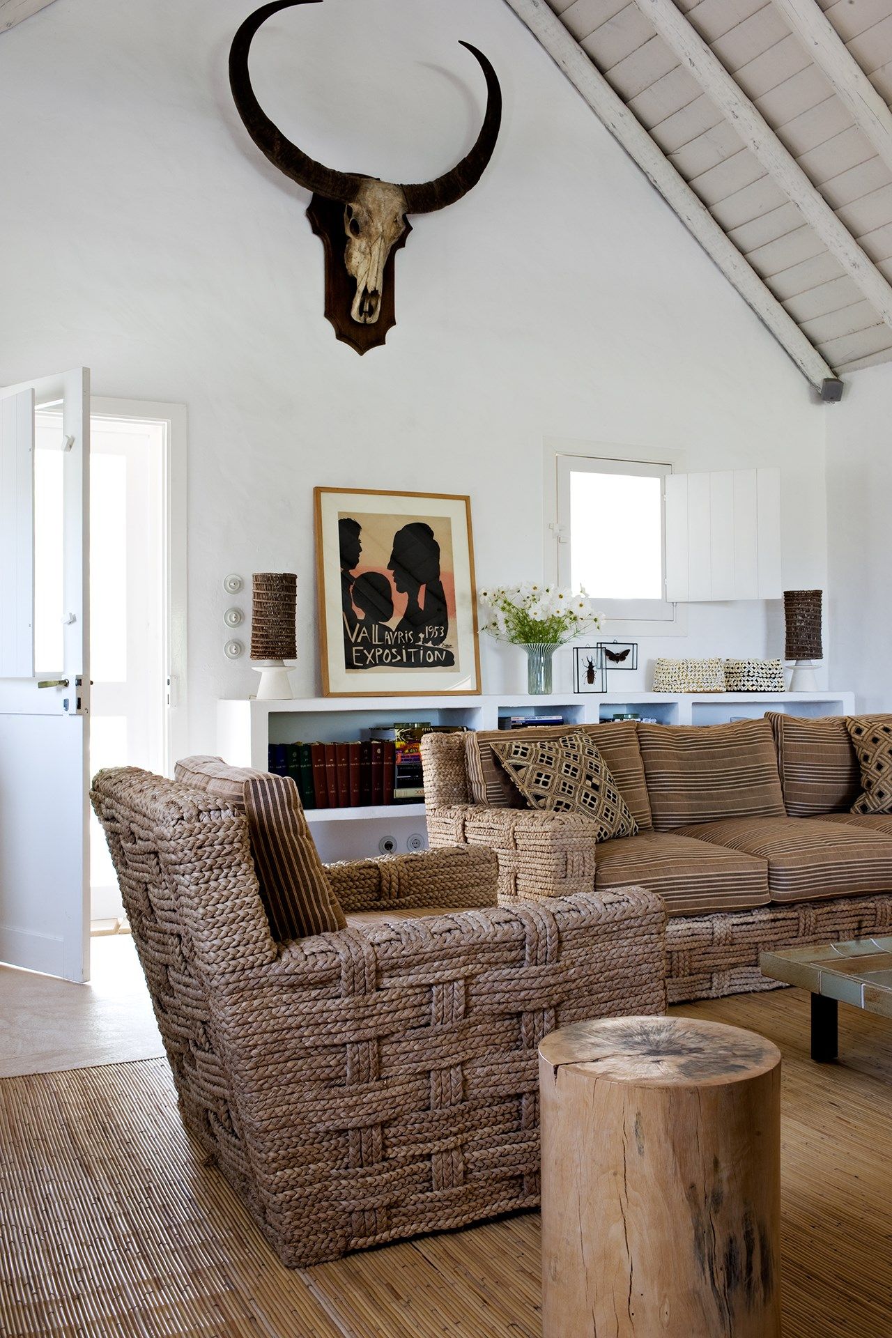 Image may contain Furniture Living Room Room Indoors Table Couch Rug Coffee Table Animal Wildlife and Mammal