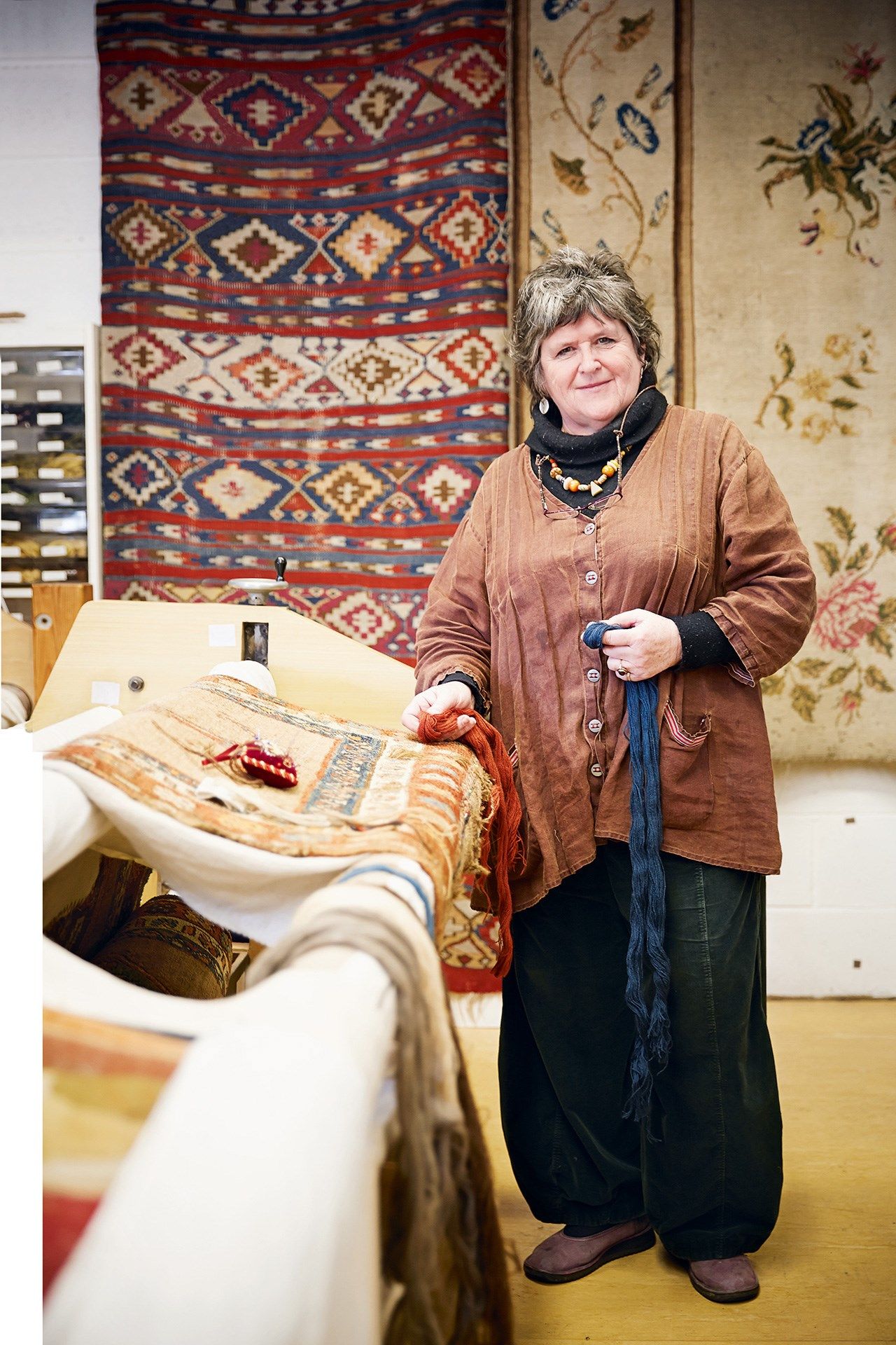 Image may contain Human Person Wood Footwear Clothing Shoe Apparel Home Decor Plywood Furniture and Shelf