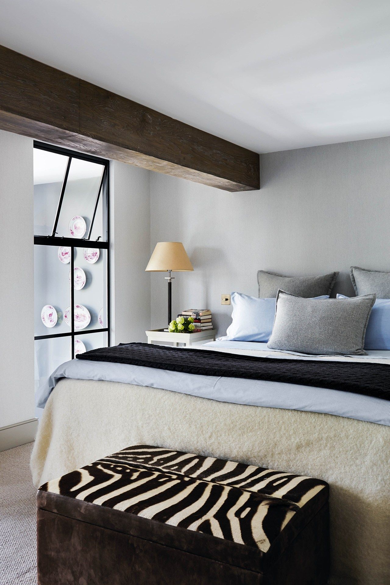 Image may contain Indoors Room Bedroom Furniture Bed Interior Design Lamp and Table Lamp