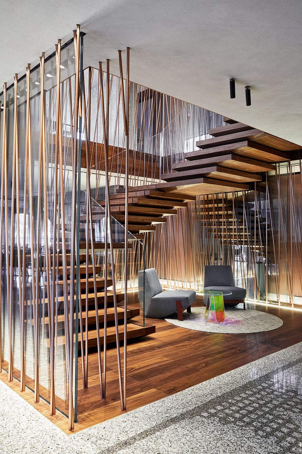 The walnut and copper pipe staircase.