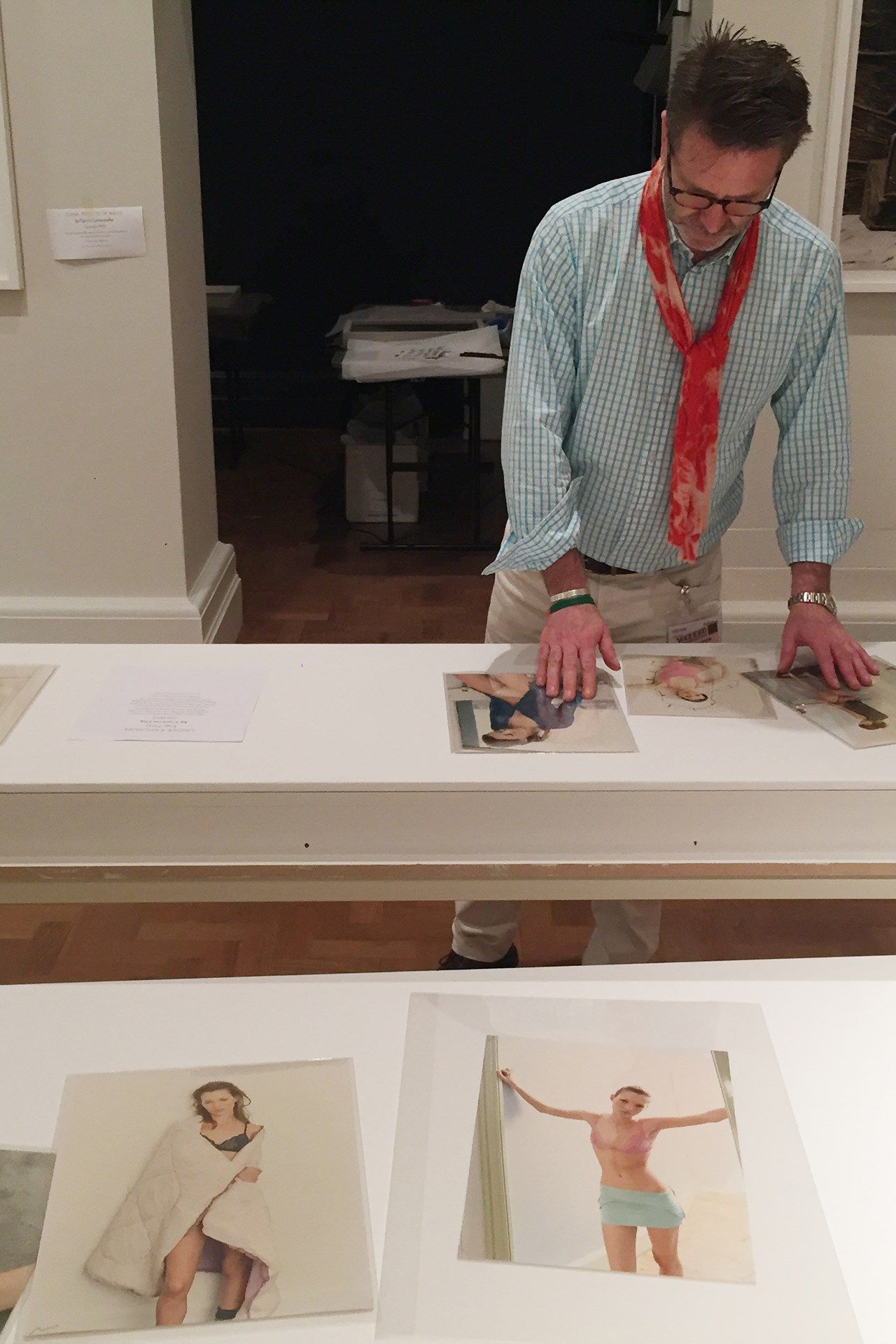 Image may contain Human Person Clothing Apparel Furniture Table Plywood Wood Shirt Desk Tie and Accessories