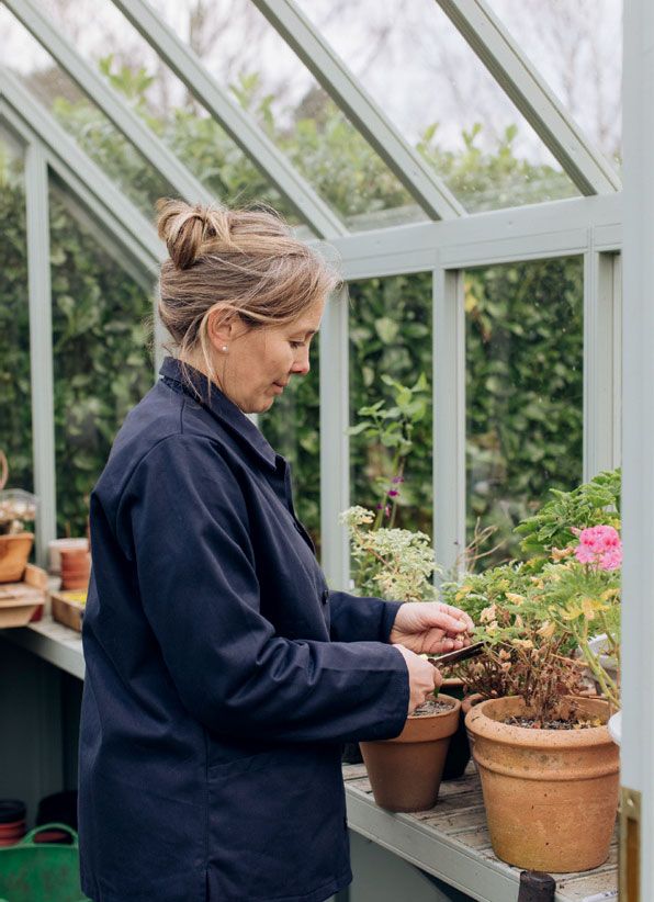 Image may contain Human Person Vase Plant Pottery Potted Plant Jar Outdoors Garden Tree and Planter