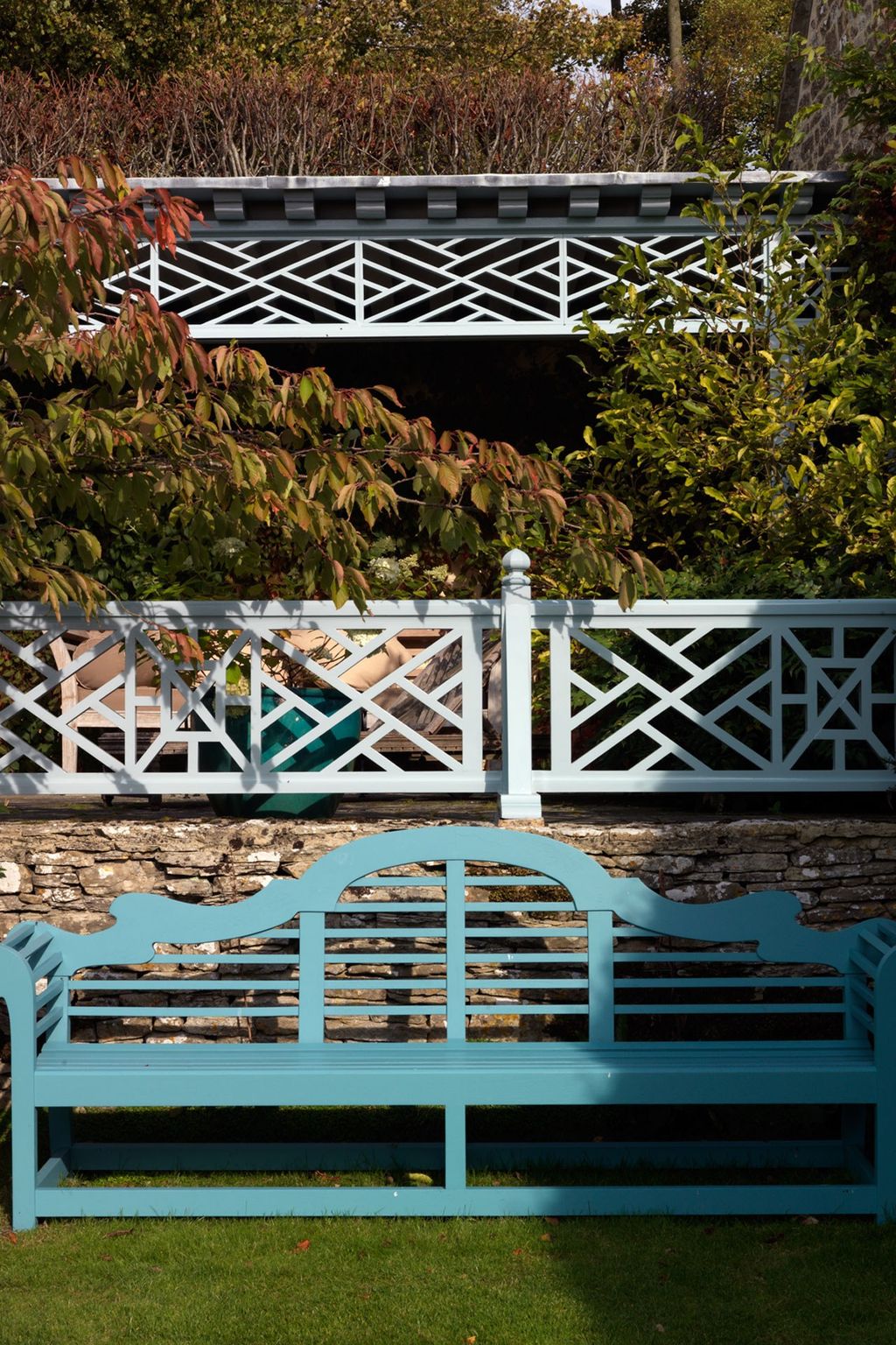 Image may contain Furniture Bench Garden Arbour Outdoors Railing and Porch