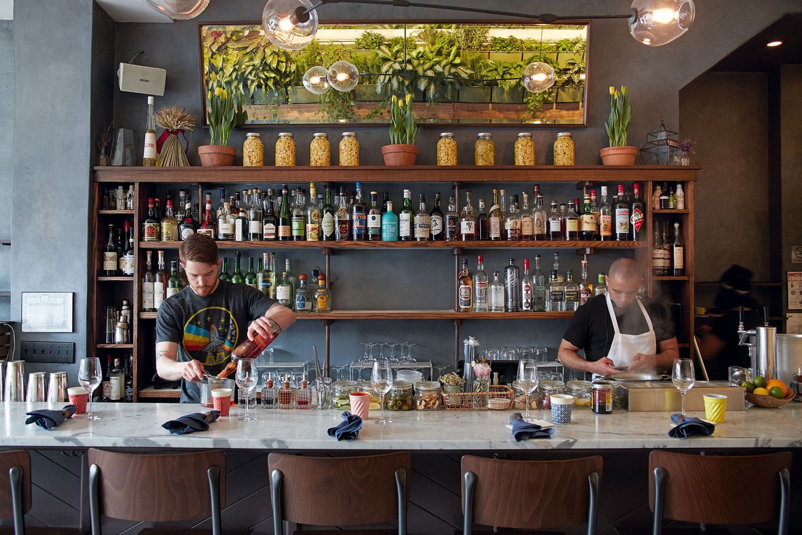 Image may contain Human Person Furniture Chair Pub Bar Counter and Shelf