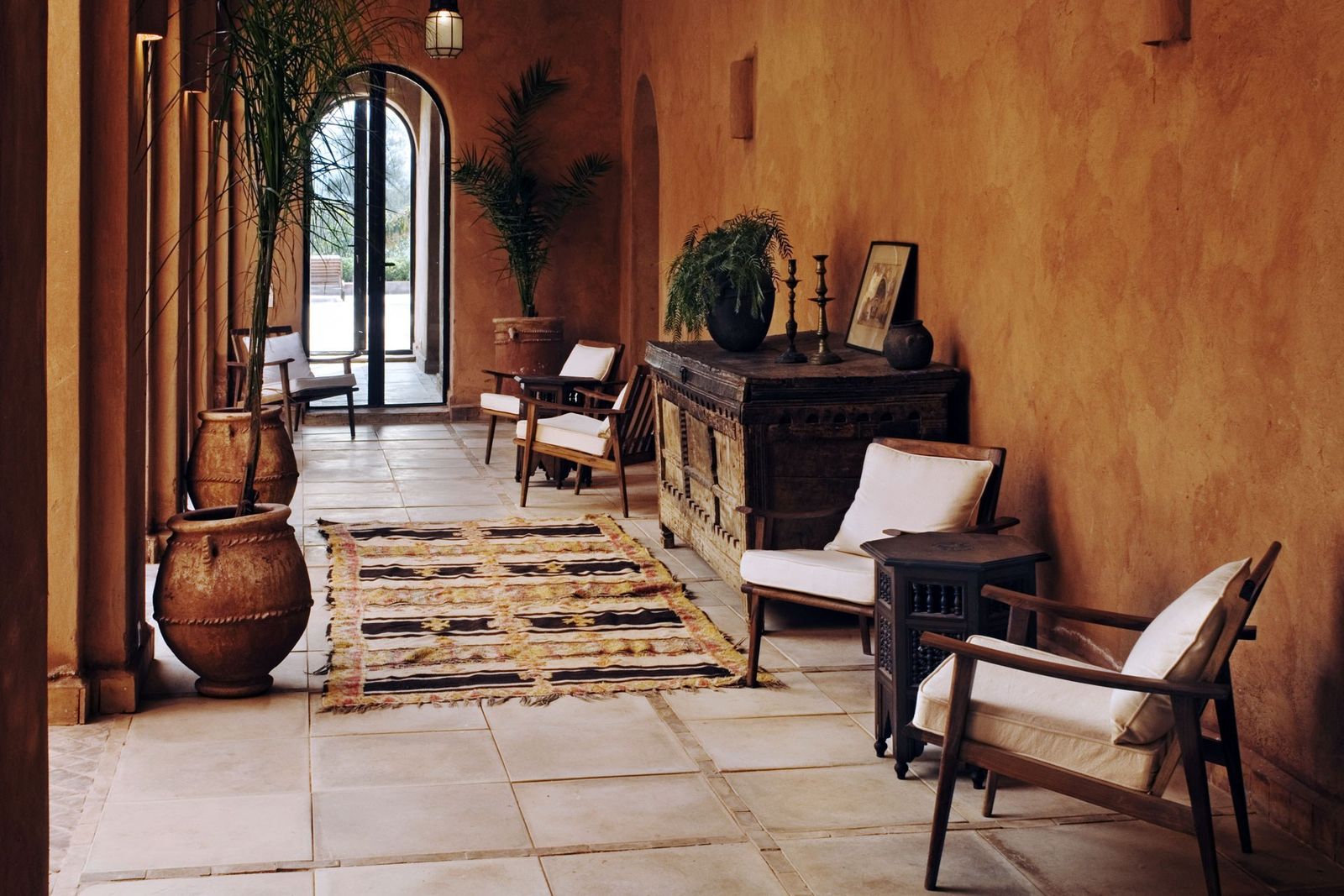 Image may contain Flooring Floor Furniture Chair Living Room Indoors Room Interior Design Wood Couch and Flagstone