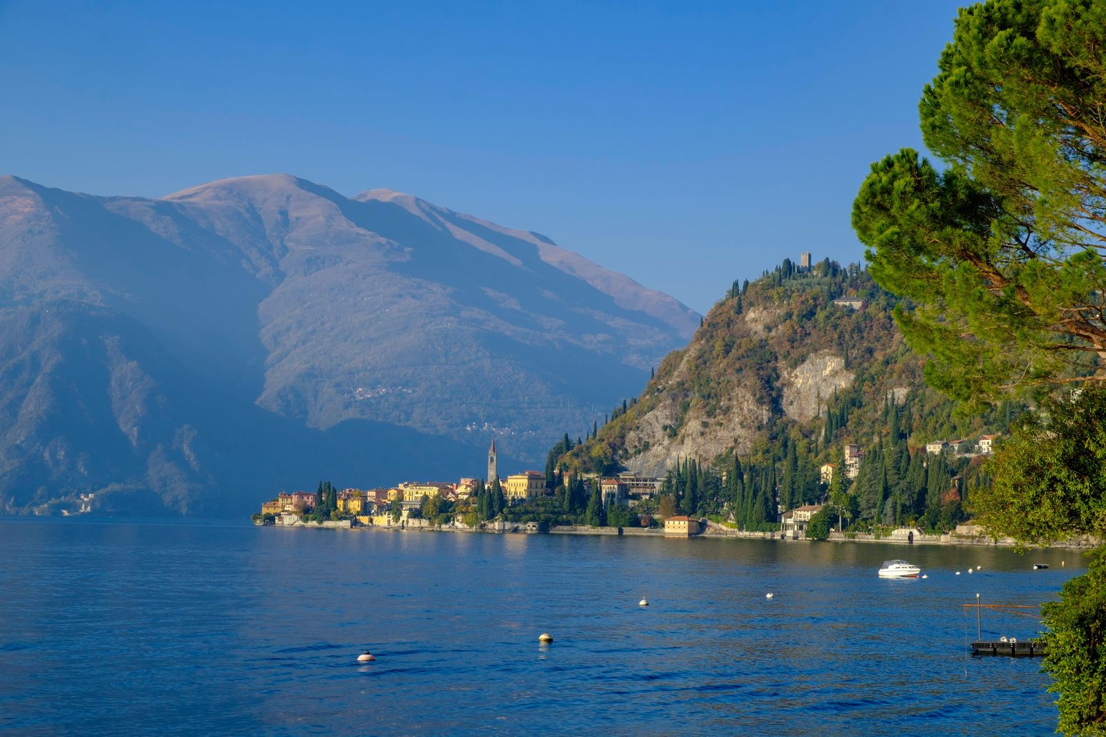 Image may contain Water Nature Outdoors Ocean Sea Land Lake Shoreline Coast Tree Plant and Mountain Range