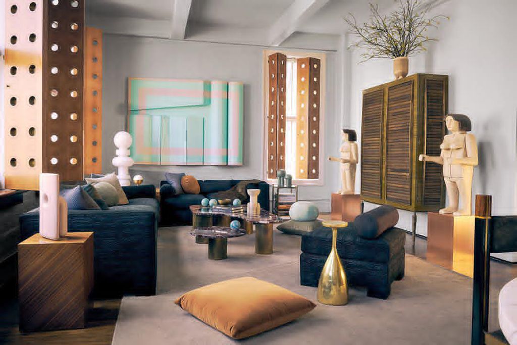 Image may contain Furniture Living Room Room Indoors Table Couch Interior Design Coffee Table Lobby and Home Decor