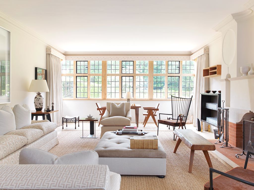 Image may contain Furniture Chair Living Room Room Indoors Table Interior Design Coffee Table and Rug