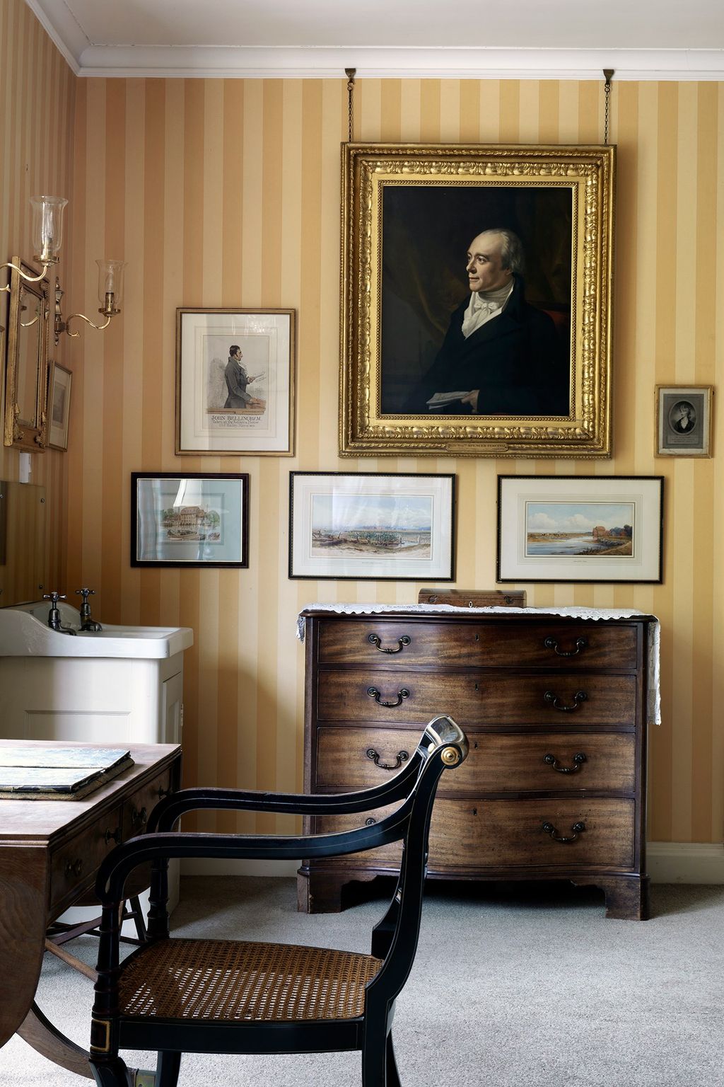 A gold frame matches the yellow wallpaper's bright scheme.