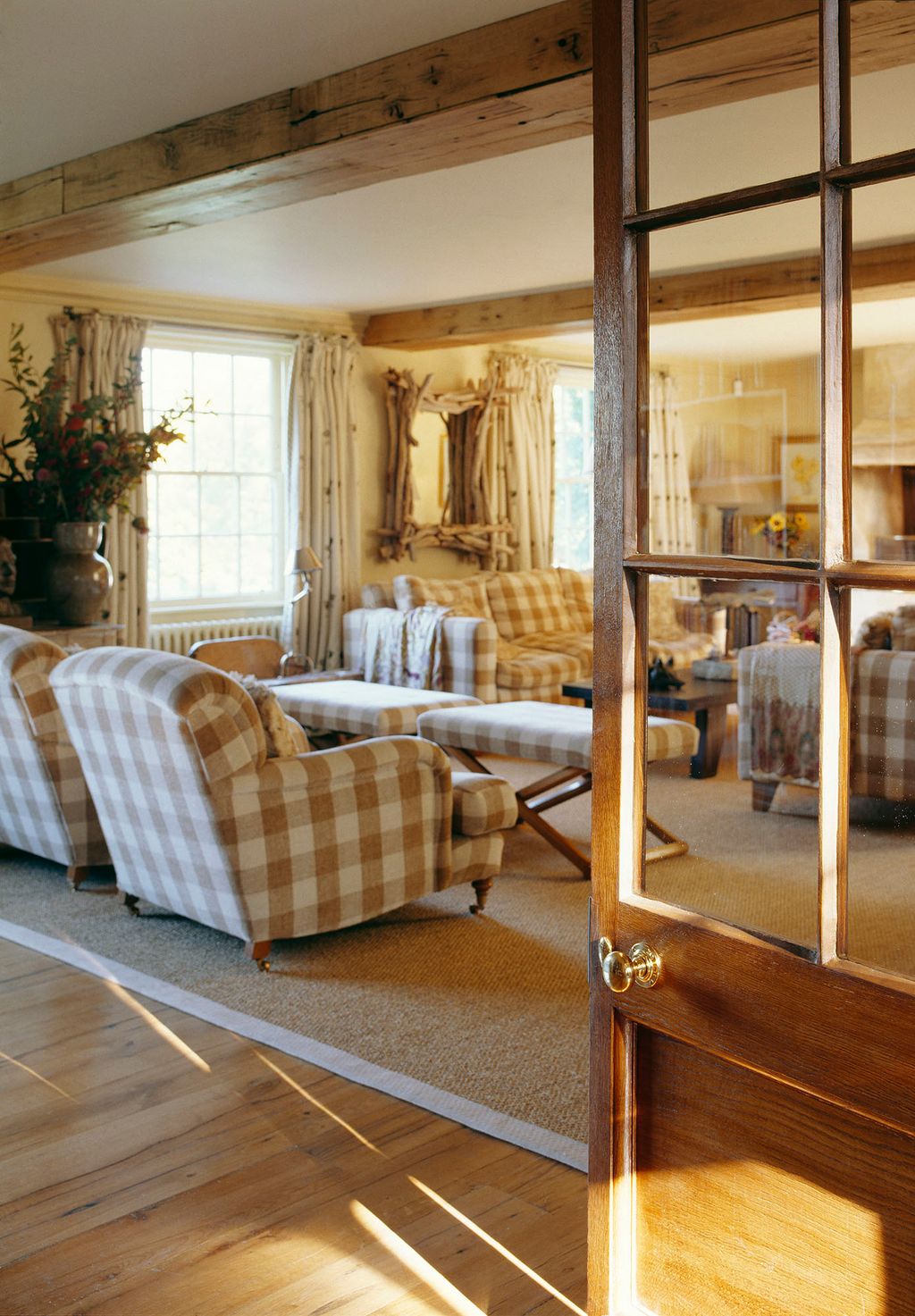 The curtains in the sitting room are 'Palm Tree' by Chelsea Textiles the floor matting from Crucial Trading.