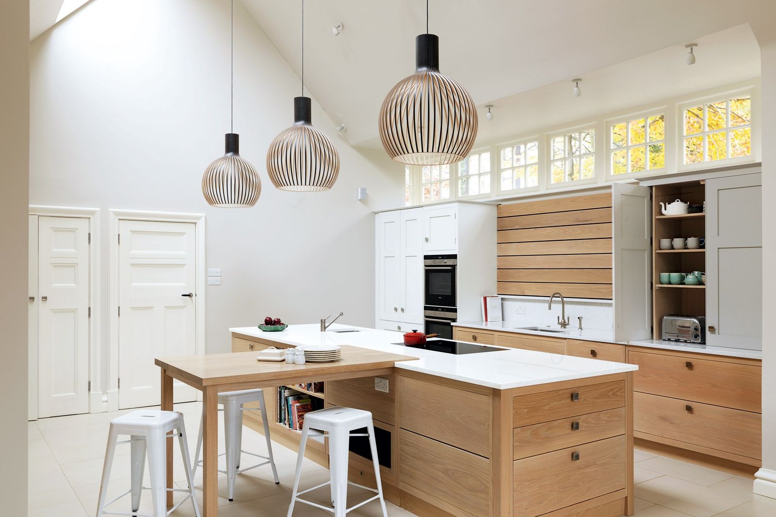 Image may contain Furniture Indoors Room Bar Stool Kitchen Island and Kitchen