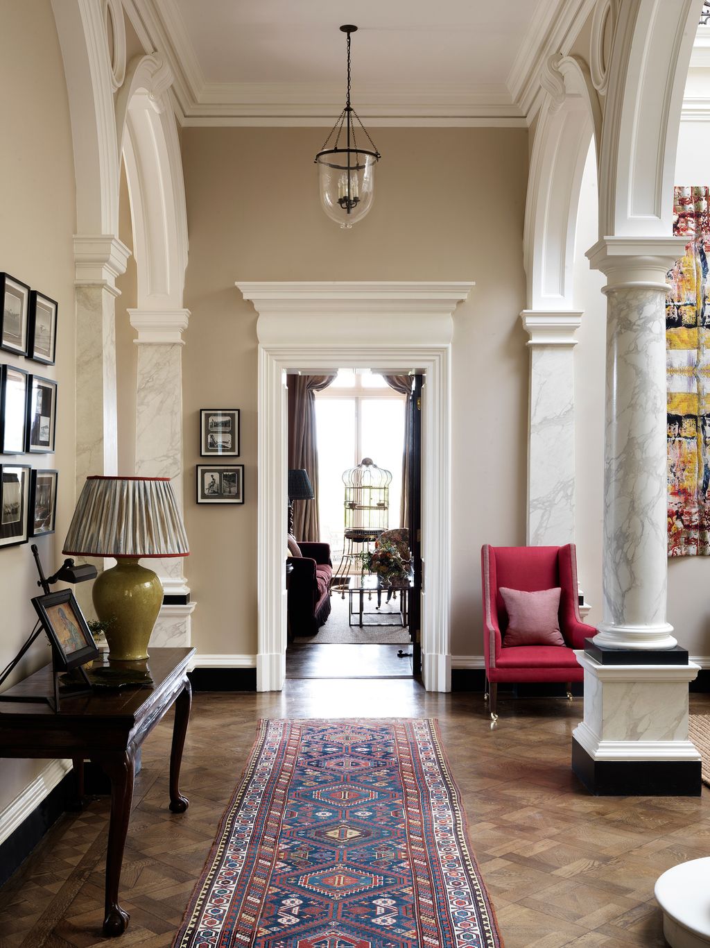 Image may contain Living Room Room Indoors Flooring Furniture Interior Design Floor Couch and Rug