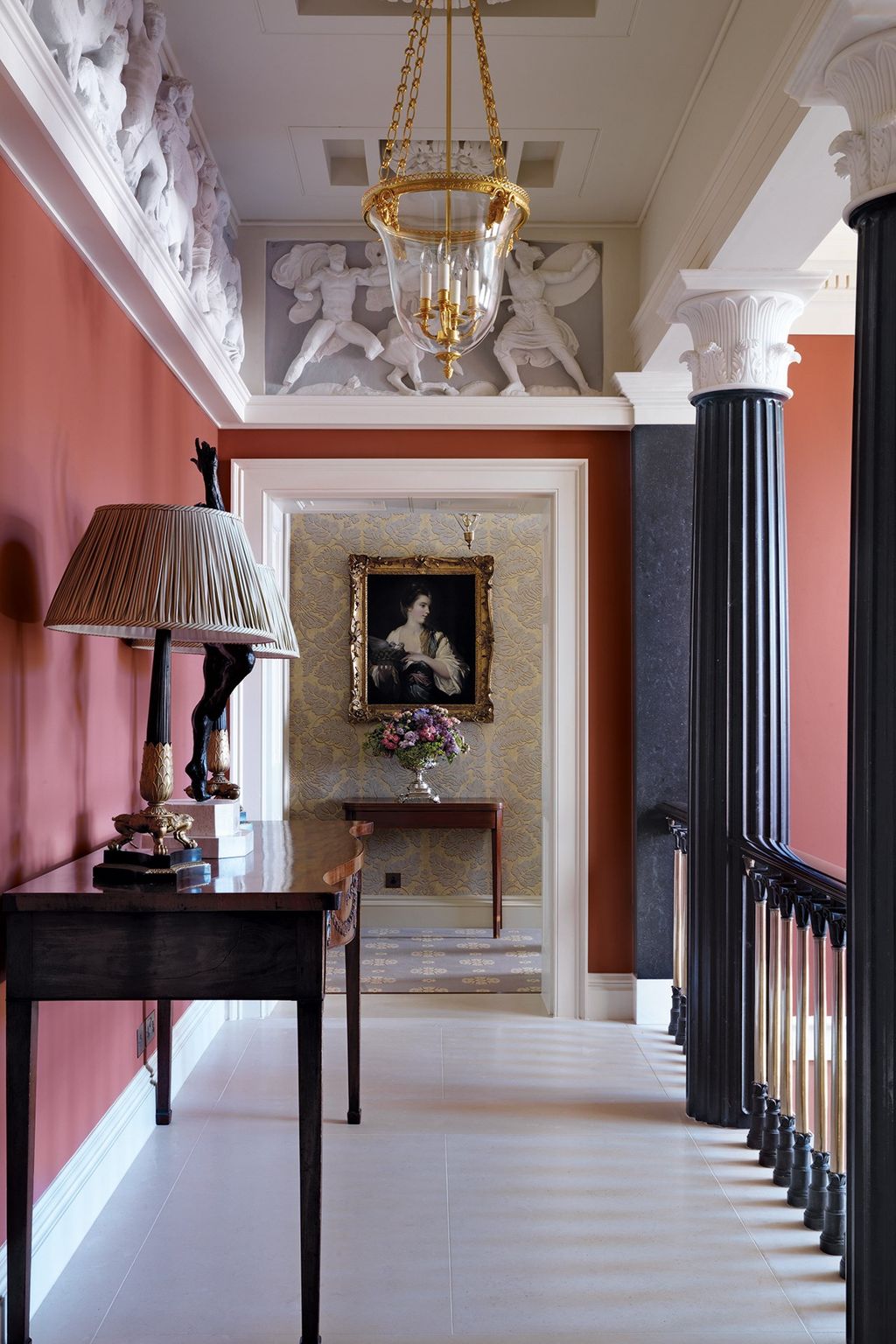 Image may contain Flooring Human Person Wood Hardwood Floor Interior Design Indoors Lamp and Table Lamp