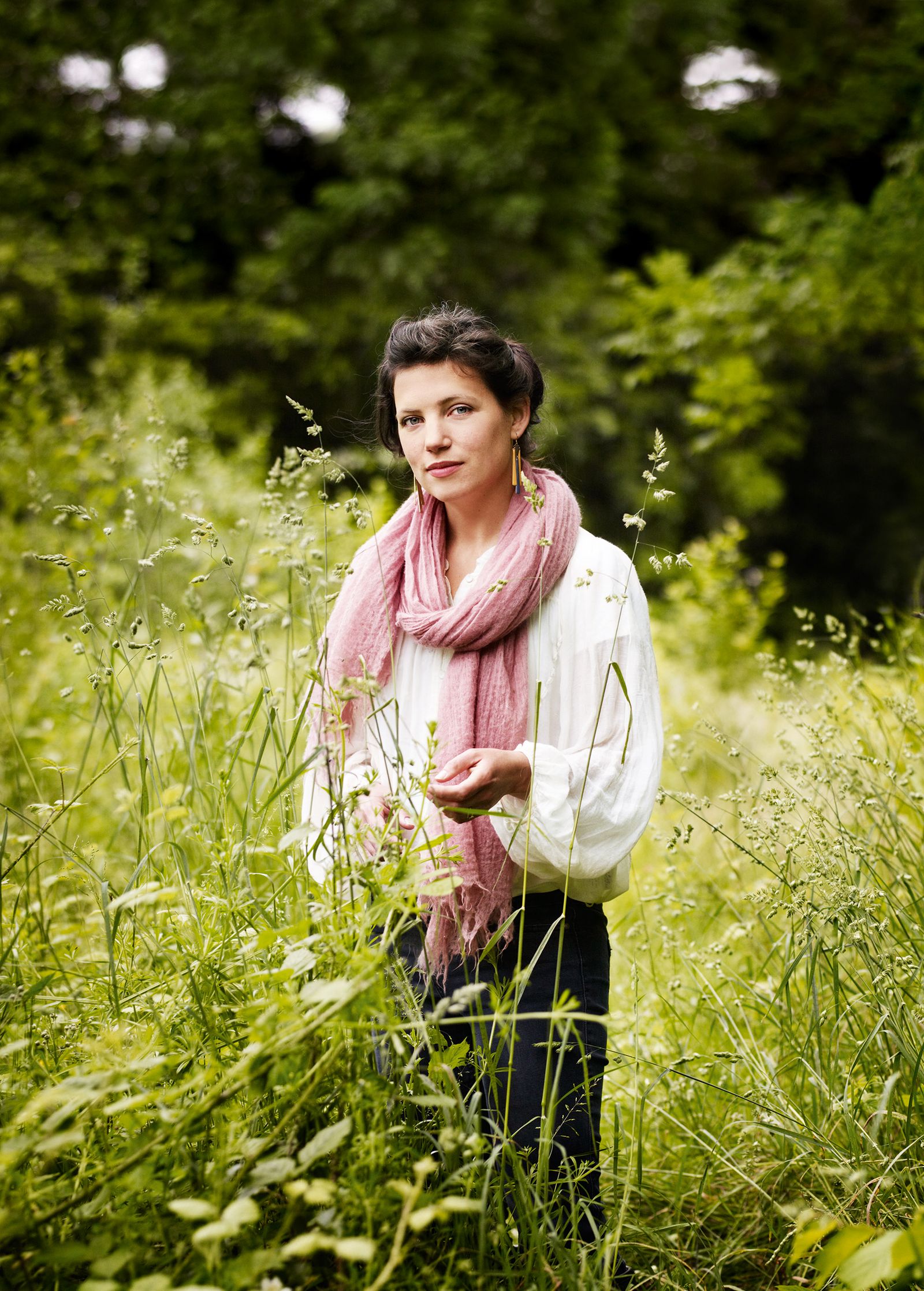 Image may contain Clothing Apparel Outdoors Vegetation Plant Human Person Sleeve Nature Vase and Pottery