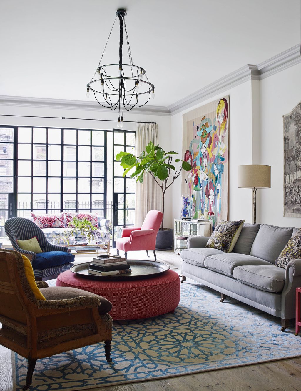 Image may contain Furniture Chair Living Room Indoors Room Rug Table and Coffee Table